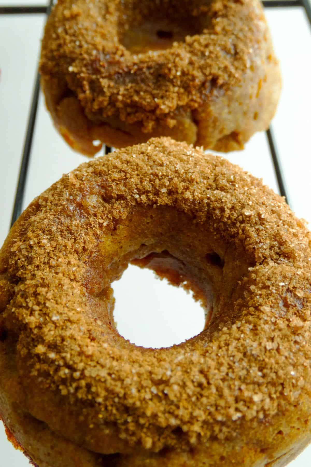 pumpkin donuts on a cooling rack
