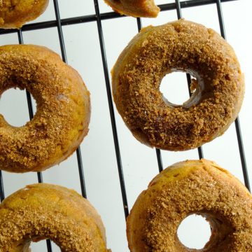 pumpkin donuts on a cooling rack