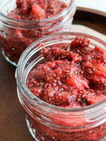 Strawberry chia seed jam in a small jar.
