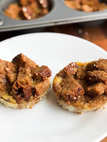 Two French toast muffin cups on a plate.
